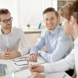 Group of businessmen discussing plans in office